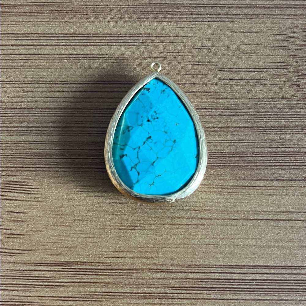 Turquoise Teardrop Pendant set in gold metal